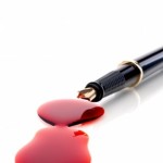 red pen spilling ink